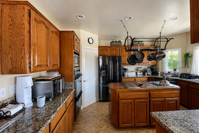 dated-kitchen-with-hanging-pot-rack dated-kitchen-with-hanging-pot-rack